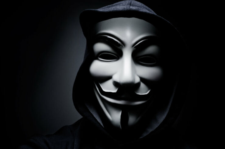 stock-photo-paris-france-january-man-wearing-vendetta-mask-this-mask-is-a-well-known-symbol-for-244924321